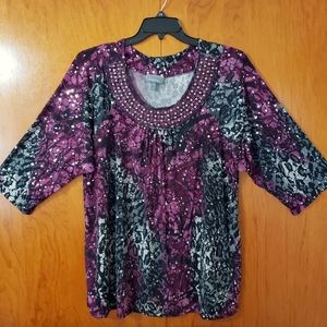 Dressy animal print blouse with embellishments